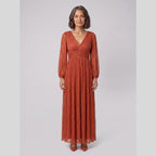 Brym | Pleated Glitter Empire-Waist Gown by Vera Noir – in burnt orange