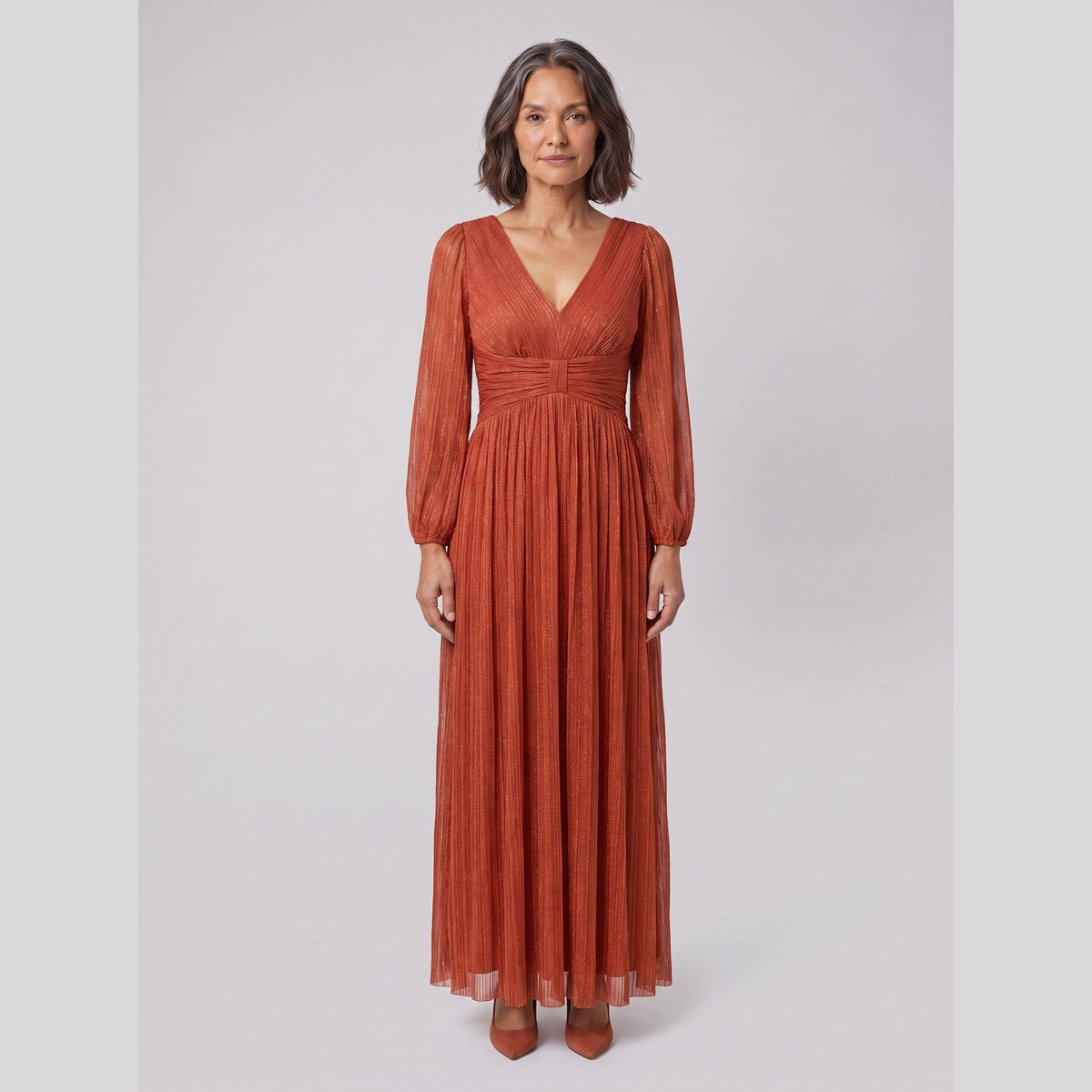 Brym | Pleated Glitter Empire-Waist Gown by Vera Noir – in burnt orange