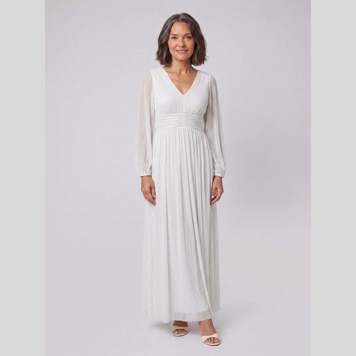 Brym | Pleated Glitter Empire-Waist Gown by Vera Noir – in white
