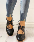 Evalyn Heeled T-Strap Shoes – front view