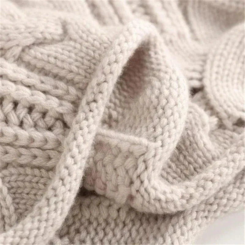 Lara Chunky Cable-Knit Turtleneck Sweater by Vera Noir – side view