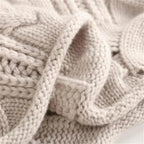 Lara Chunky Cable-Knit Turtleneck Sweater by Vera Noir – side view