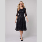 Novara | Sequin Lace Tea-Length Dress by Vera Noir – in black