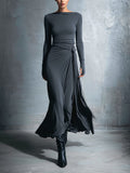 Queliravessa maxi dress, front view showing the draped side knot