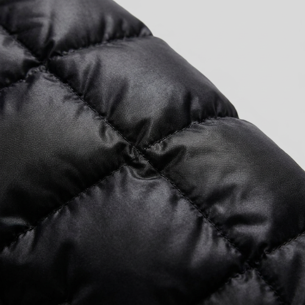 Quinna | Quilted Hooded Long Puffer Coat – detail view quilted fabric
